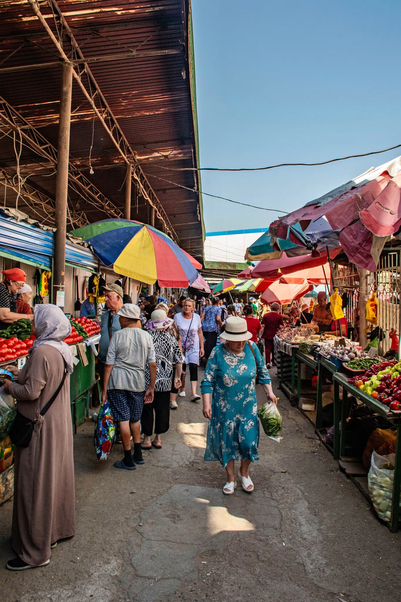 bustling market scene with people and colorful stalls in Kyrgyzstan