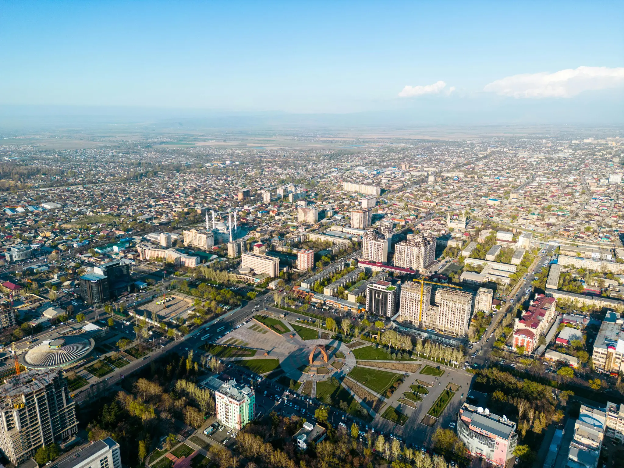 aerial view of Bishkek city with mountains in background