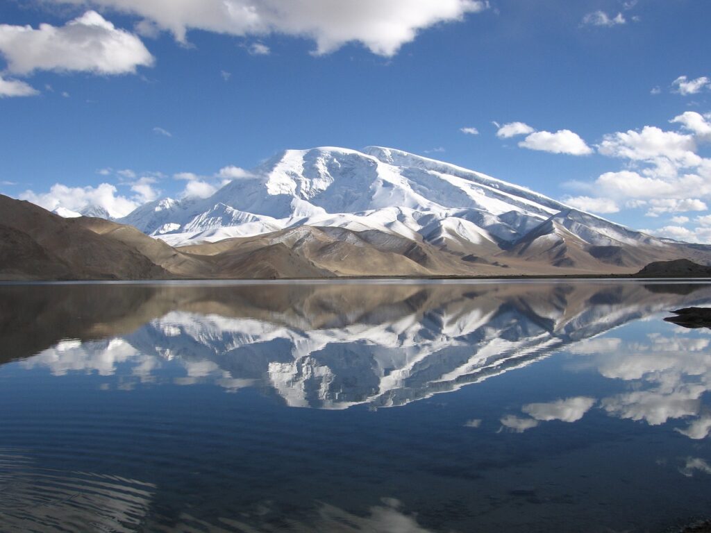 lake and white mountains in the background